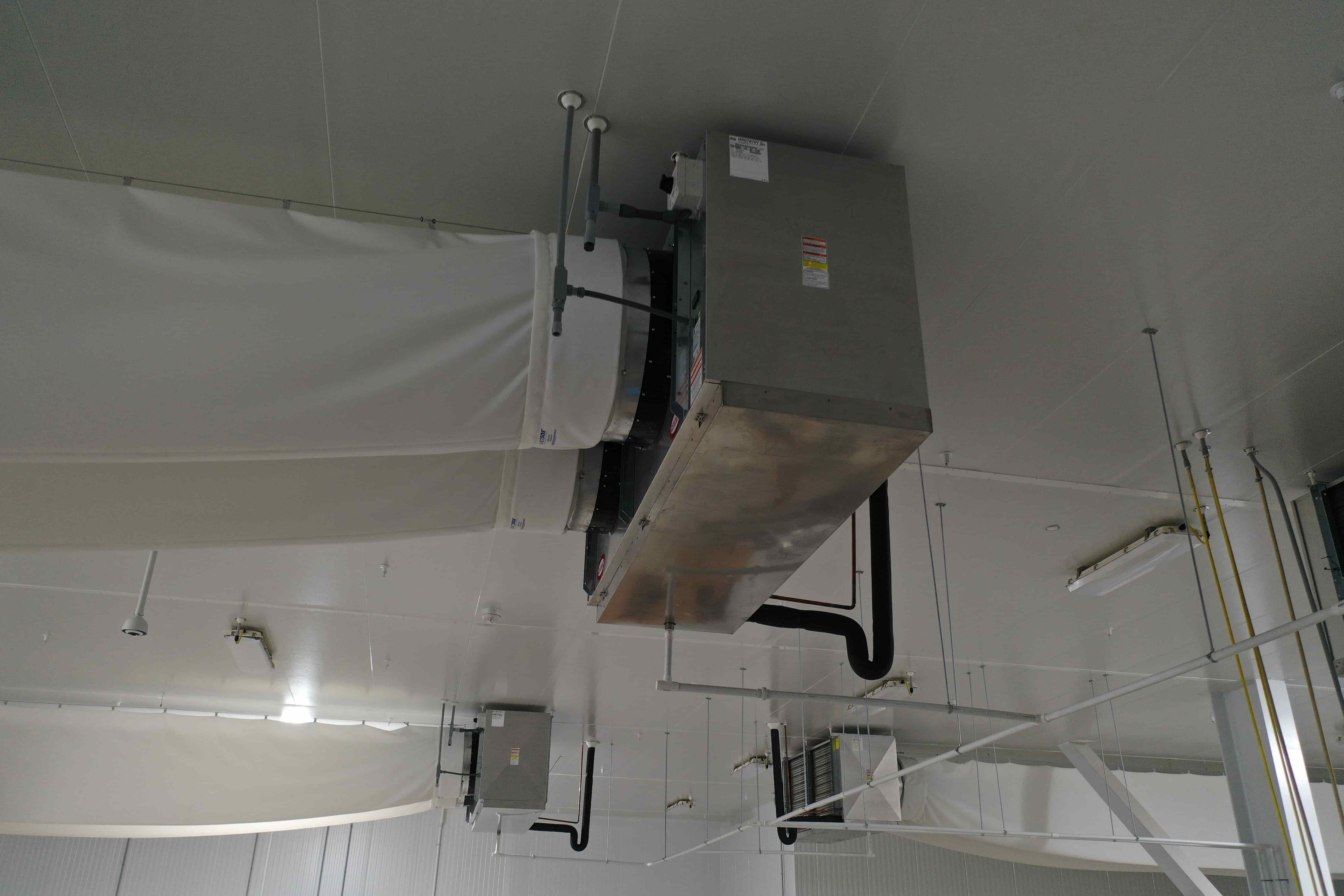 SB6023a:  EVAP 2A Evaporative Cooler – Trenton THP106ME-T4A-SN Dual-Fan High-Profile Evaporator with Fabric Duct (~15,000 CFM, 460 V 3-Phase) – EVAP 2A Located Mid-North Wall of 37 °F Cold Pack Room, photo 2
