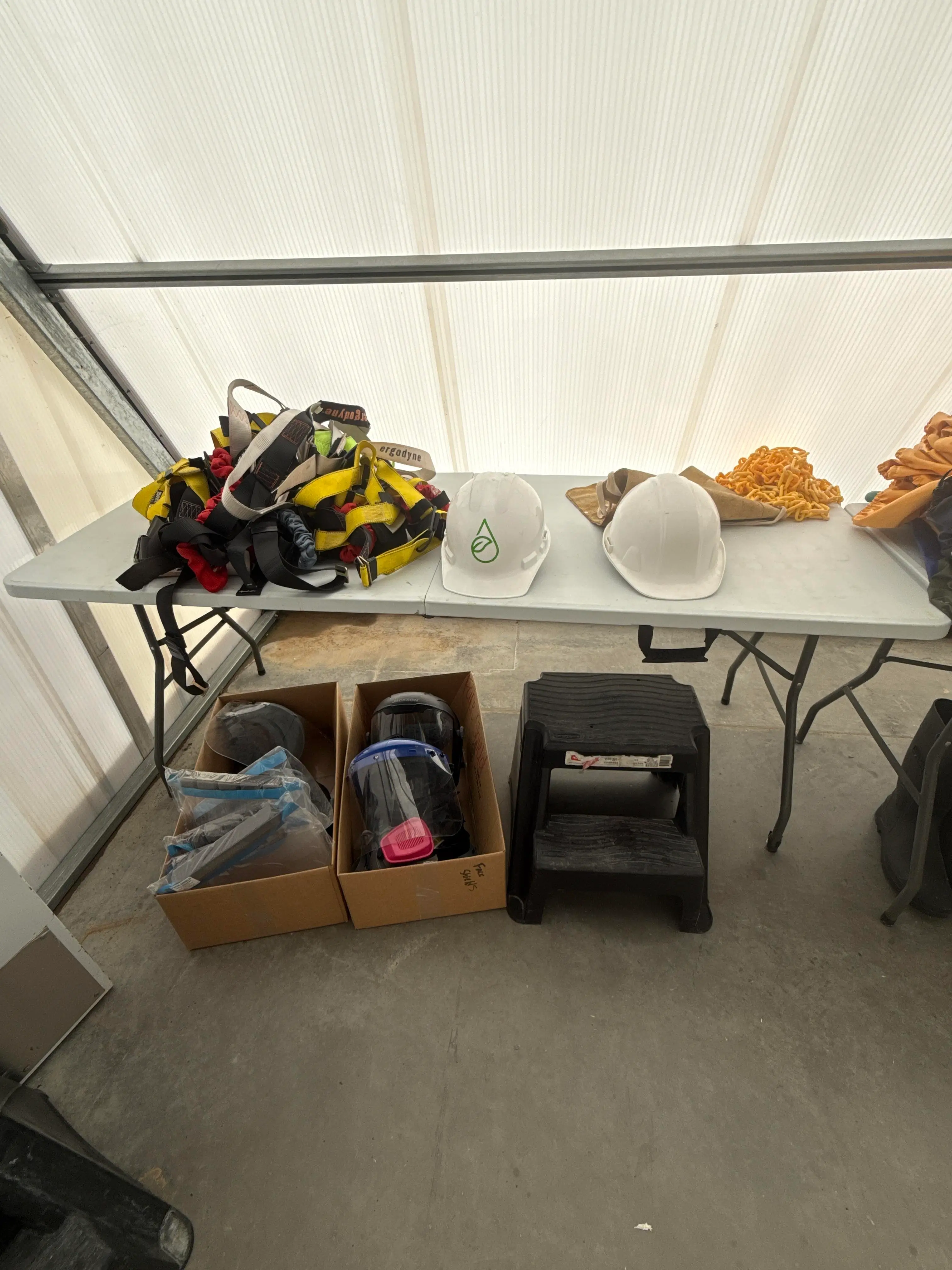 Mixed Safety Gear Lot with Harnesses, Hard Hats, Face Shields and Step Stool