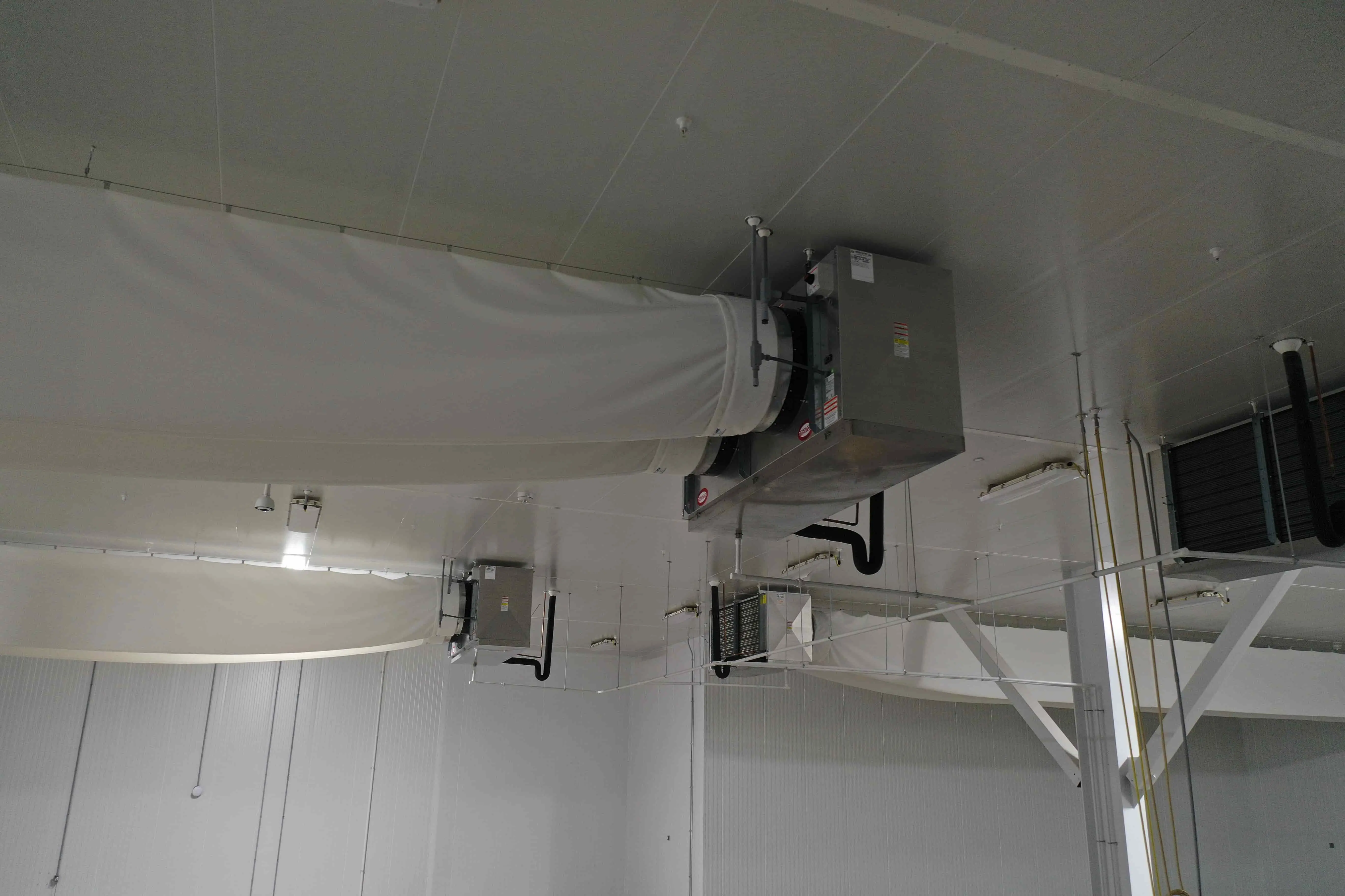 SB6023a:  EVAP 2A Evaporative Cooler – Trenton THP106ME-T4A-SN Dual-Fan High-Profile Evaporator with Fabric Duct (~15,000 CFM, 460 V 3-Phase) – EVAP 2A Located Mid-North Wall of 37 °F Cold Pack Room