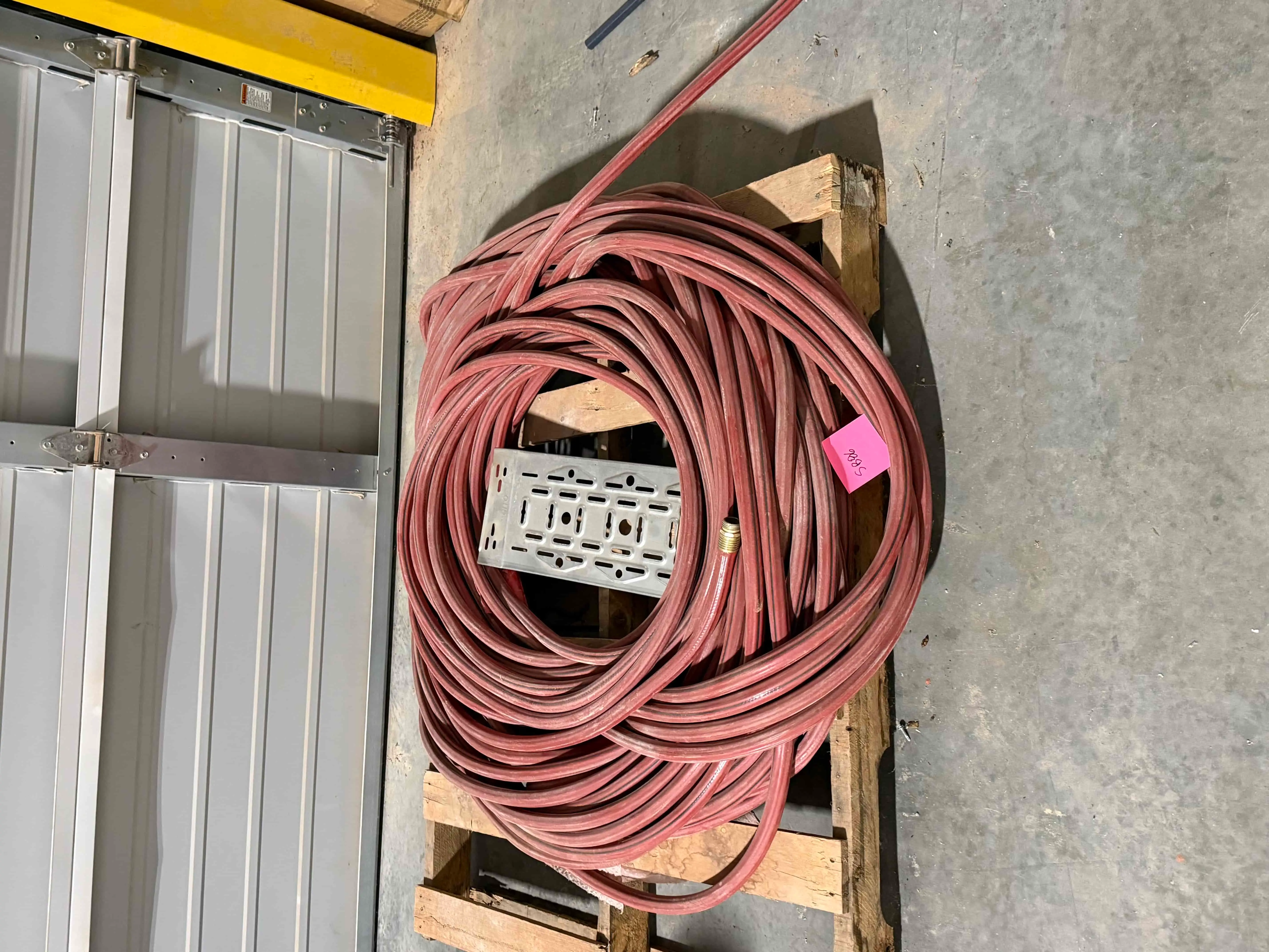 SB86: Industrial Red Hose Coil on Pallet