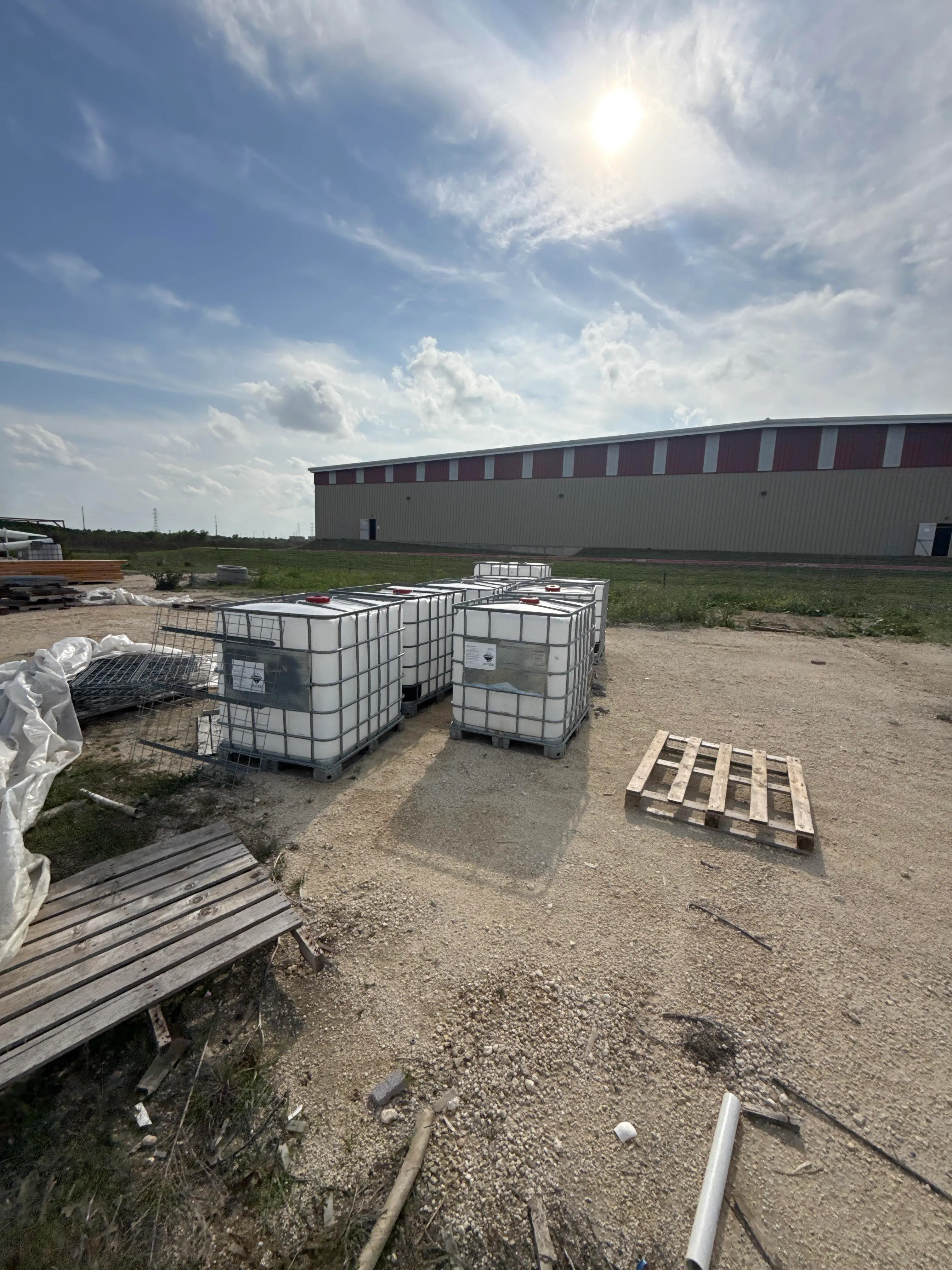 Bulk Lot of Used IBC Totes in Steel Cages with Plastic Tanks